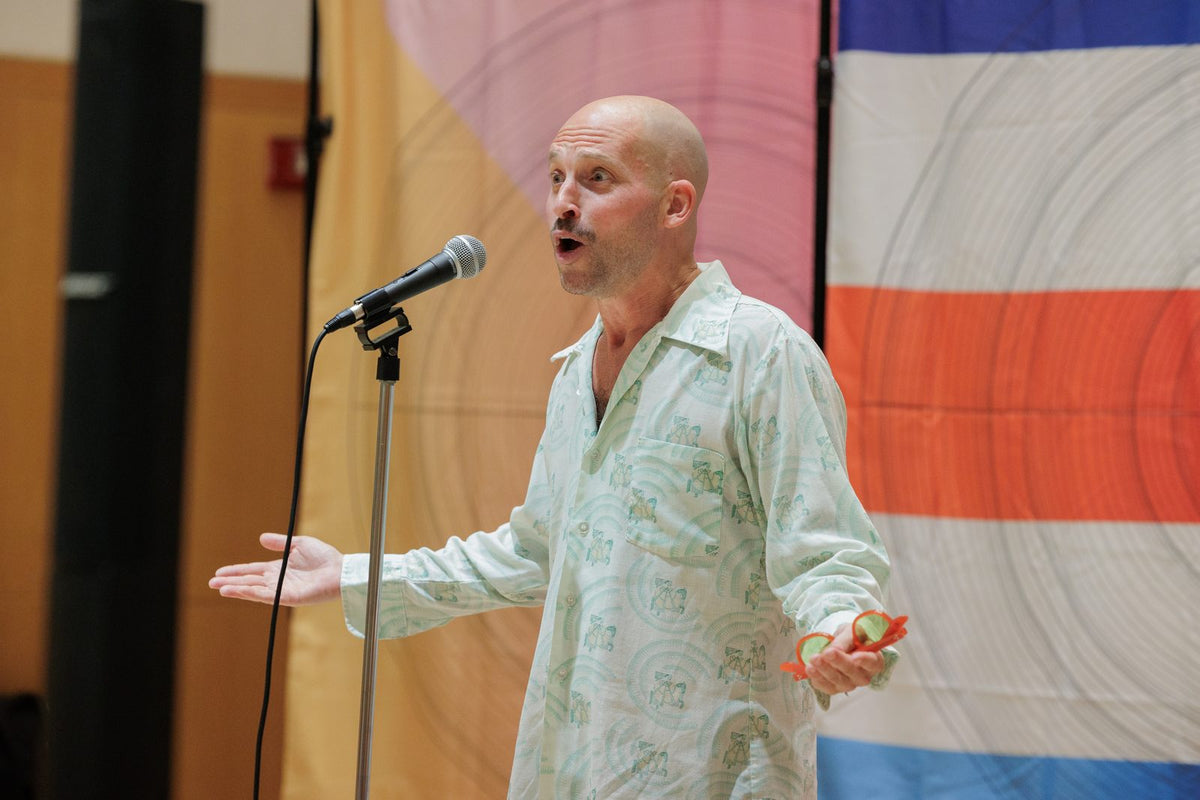 Matt Landau speaking at a microphone